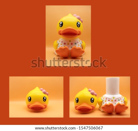 Yellow duck doll That is a water cylinder. Able to separate the headers On an orange background, isolated