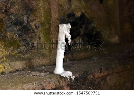 Beautiful white candle in old church