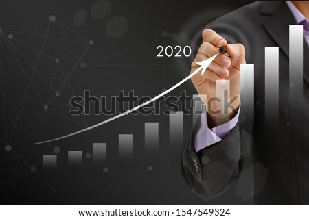 Growth success in 2020 concept. Businessman plan and increase of positive indicators in his business. Royalty-Free Stock Photo #1547549324