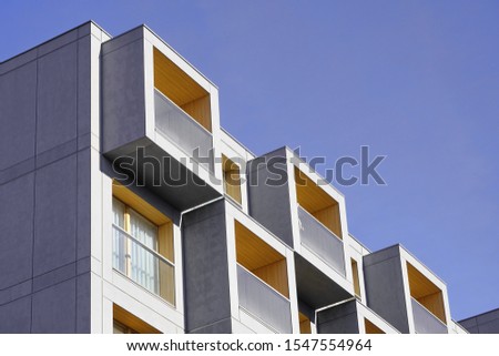 details of a new apartment building on a Sunny day. modern construction of houses, contrast of buildings Royalty-Free Stock Photo #1547554964