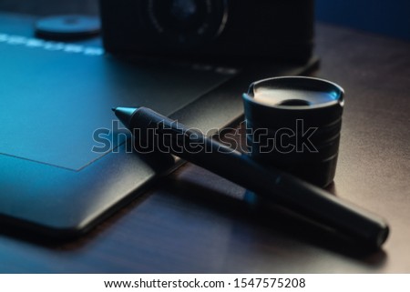 Post-production of photos using a graphics tablet.
 The workplace of the photographer-designer.