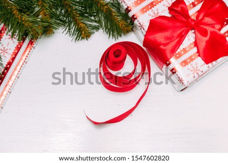 Christmas holiday composition. Christmas gift, fir tree branches and Christmas ornament on white background. Flat lay. top view.