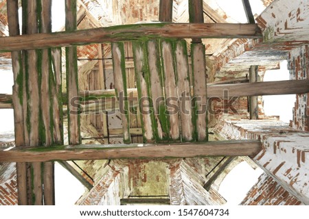 old brick walls, ruined wooden floor on the belfry