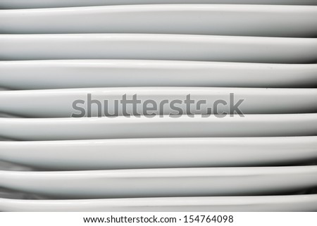 group of white porcelain plates stacked