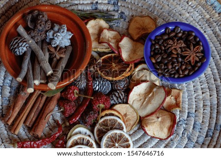 autumn spices and dried fruit on a vintage background