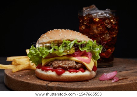 fresh tasty burger on wooden board