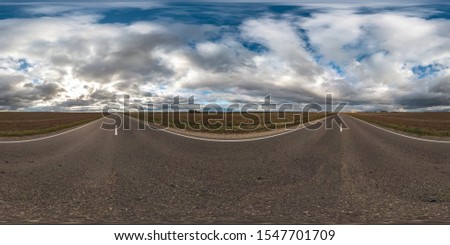 full seamless spherical hdri panorama 360 degrees angle view on asphalt road among fields in autumn day with beautiful clouds in equirectangular projection, ready for VR AR virtual reality content