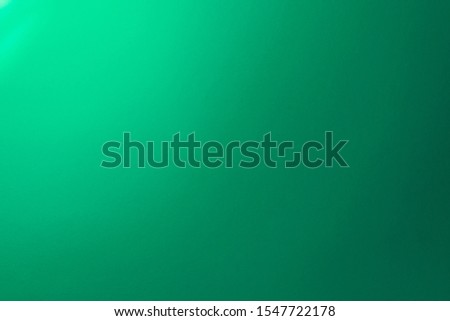 Gradient mint colored background Gradient light from candle Royalty-Free Stock Photo #1547722178