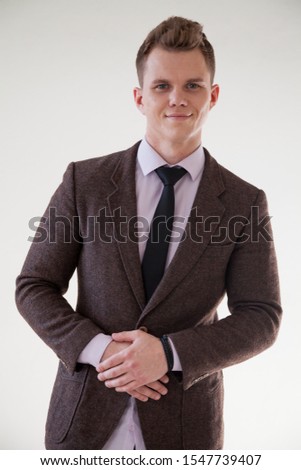 portrait of a handsome fashionable man in a business suit in the office