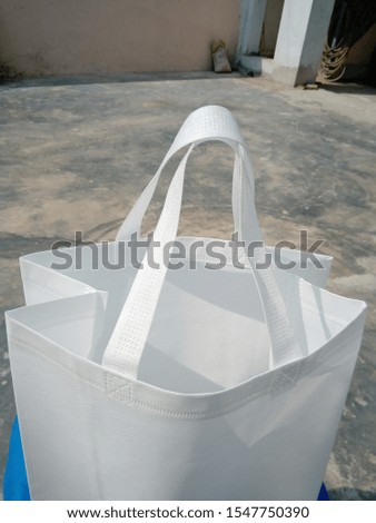 isolate top view White Color ECO Friendly Bag with White Handle, PP Non Woven Box Type Shopping Bag with Beautiful Background