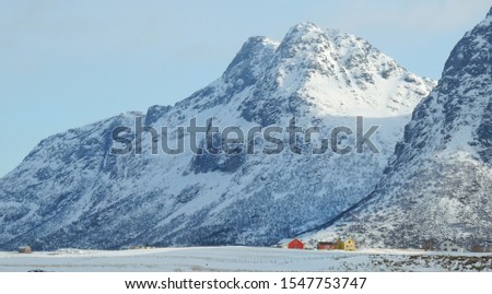 Beautiful scenery of snow mountains and fisherman village at Lofoten during winter time of Norway,  Arctic,Scandinavia, Europe. 
