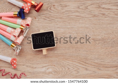 Celebration wood background with various party confetti accessories.Christmas concept,with decoration for New Year concept copy space,Top view,flat lay