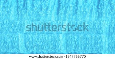 Texture, background, pattern, collection, wrinkled silk fabric "electric" blue. 3D pleated wrinkled and wrinkled light camel fabric made of pure silk