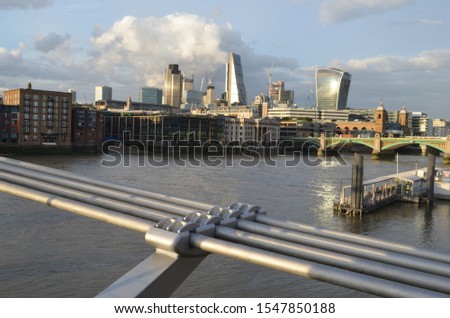 london river with millenium bridge in evening light