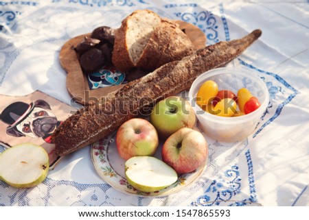 Bread, vegetables, fruits, sweets for a picnic