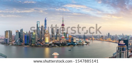 panoramic view of shanghai skyline at dusk, beautiful huangpu river with pudong financial center and the bund, China.
