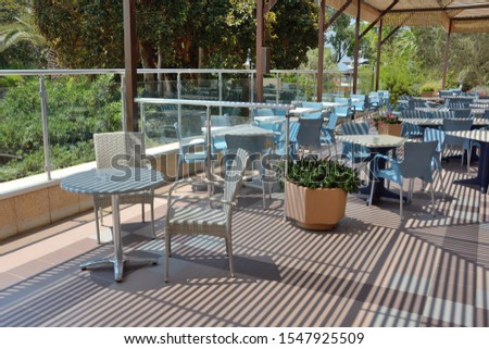 Summer cafe on the terrace in the open air without people