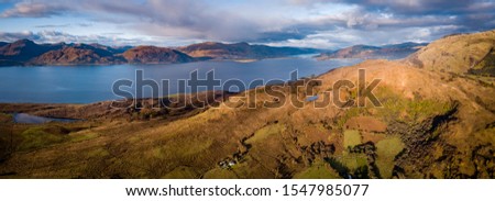 an aerial shot of loch linnhe a sea loch in the argyll region of the highlands of scotland near glen coe and fort william showing the calm waters and surrounding mountain landscape in autumn