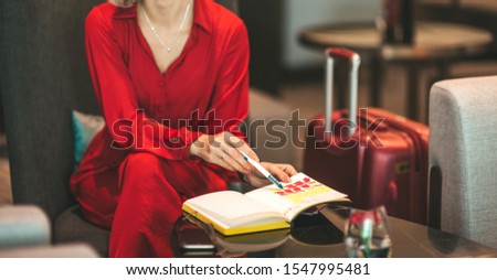 Working in comfortable place. Attractive businesswoman sitting in the hotel lobby. Copy space on the right side