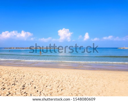Gorgeous calm blue sea and free sand beaches of Tel Aviv. Beautiful sea surf and blue sky. Magical comfortable warm and clear season of Israel Mediterranean 
