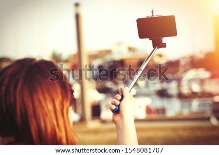 Woman making the selfie in sunlight