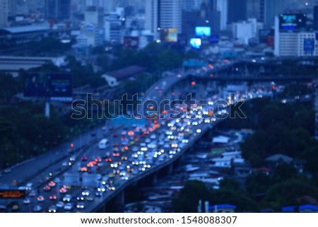Aerial shot traffic jam or collapse in a city street road at twilight time. Blur focus technic.Bangkok Thailand