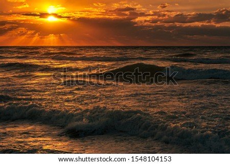 seascape sunset with cloudy sky and high surf