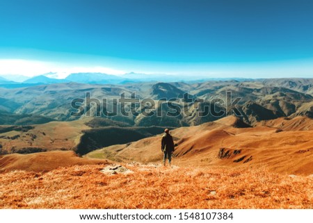 A man walks along the valley. Caucasian ridge. Mountain landscape. view