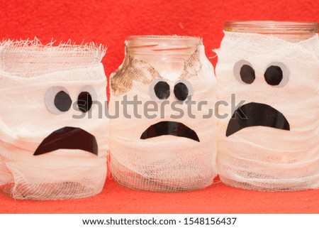 sad faces on gauze tanks