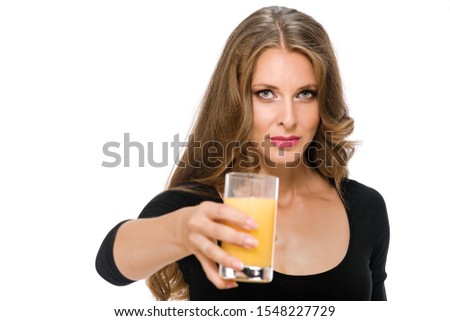 Portrait of young healthy woman on diet holding glass of fresh orange juice