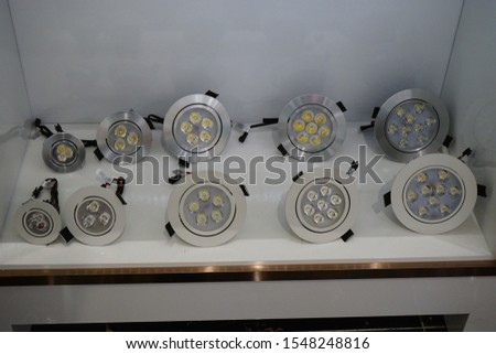 Many types of lighting equipment spare parts are on the racks. 