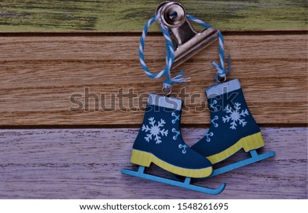 decorative wooden skates on the background of colored boards