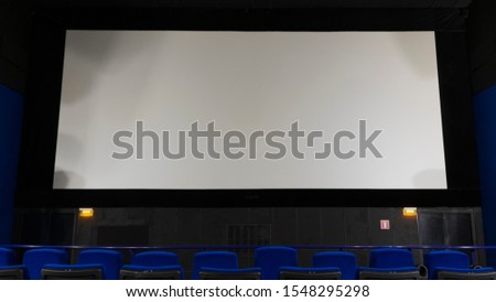 mocap , big screen in the role of a Billboard. white color cinema screen for your advertising, copy space moquette advertising. Royalty-Free Stock Photo #1548295298