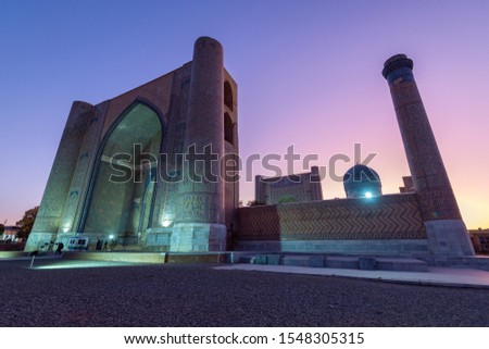 View of Sher-Dor Madrasah minutes after sunset from the opposite side of the Registan, heart of the ancient city of Samarkand during the Timurid dynasty. Picture taken at Samarkand, Uzbekistan.