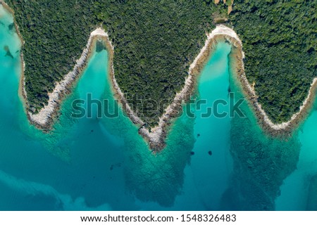 Aerial view of sea and beach in a lagoon on Cres ( isola Cherso )  Island Croatia, close to Punta Kriza; Punta Croce. It is a part of national where rocks and sand and forest merge on a coast. 