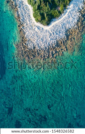 Aerial view of sea and beach in a lagoon on Cres ( isola Cherso )  Island Croatia, close to Punta Kriza; Punta Croce. It is a part of national where rocks and sand and forest merge on a coast. 