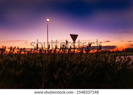 Sunset with a lamp in the Picture and a nice mood of the sky with stunning colors