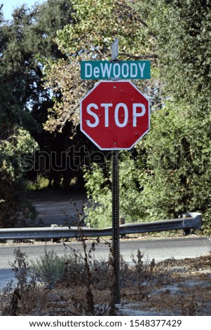 a stop sign in countryside