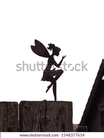 Shilhouette of dancing tinkerbell as garden fence decoration