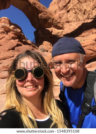 Fun Couple Hiking at Arches National Park, Utah