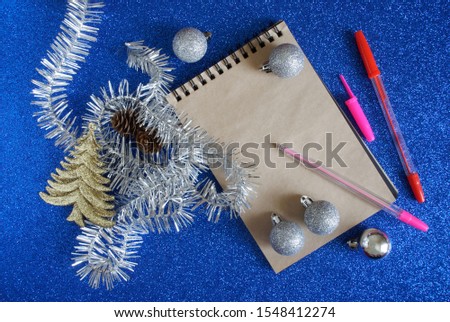 Christmas letter for Santa lies on a blue background. Template for a list of gifts for Christmas and New Year holidays. Flat lay. Place for an inscription.