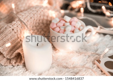 Christmas decor with a cup of cocoa and marshmallows.