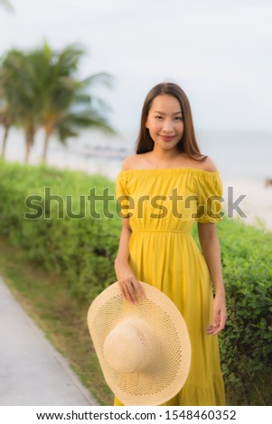 Portrait beautiful asian women happy smile relax on the tropical beach sea ocean in holiday vacation