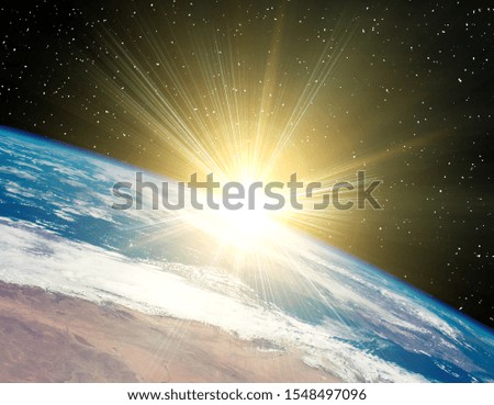 Sunrise on the planet earth. The elements of this image furnished by NASA.
