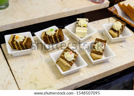 Closeup Picture of Sweet Brown Chocolate Cakes for Breakfast in Banquet of Hotel