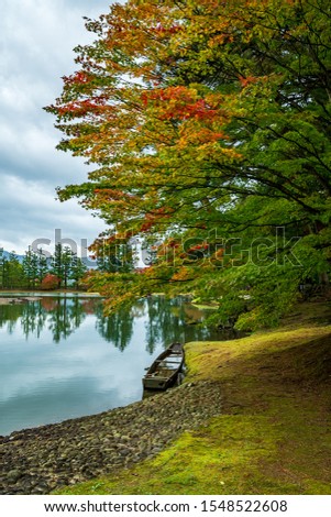 a peaceful lake at the Motsuji, Japan in autumn