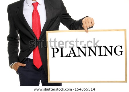 Businessman holding a white board