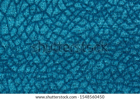 Saturated fabric texture in shiny blue colour. High resolution photo.