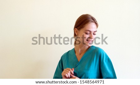 Portrait of a friendly female doctor. isolated