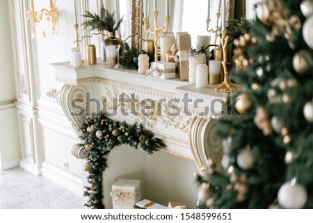 Close-up branches of Christmas tree with ornaments. Christmas balls, ribbon bow, snowflakes, pine cones and lights.